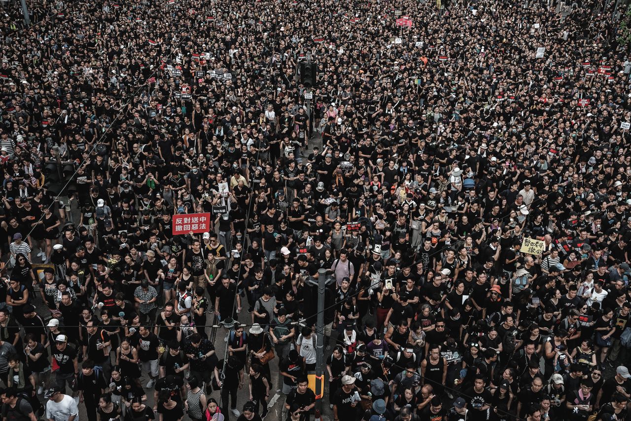 Aerial view of a large crowd demonstration in Hong Kong, demanding justice.